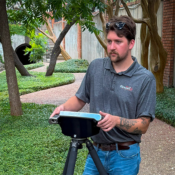 Flexijet North America technician measuring a Flexijet North America technician measuring a